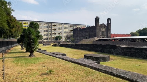 Ruins of Tlatelolco at Plaza de Las Tres Culturas, or Three Cultures square, backgrounded by the Temple of Santiago in Mexico City, Mexico. photo