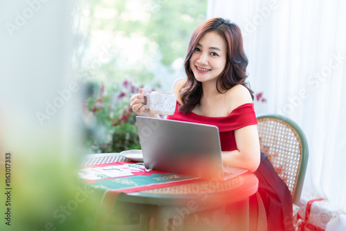Obraz na płótnie asian freelance people business female talking making using casual working with laptop computer and coffee at home in the living room indoors Decoration During Christmas x-mas and New Year holidays. w salonie