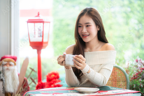 Obraz na płótnie Portrait beautiful asian woman holding of positive the having cup of coffee,milk or chocolate at home in the living room indoors Decoration During Christmas x-mas and New Year holidays. w salonie