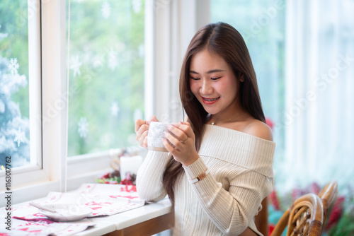 Obraz na płótnie Portrait beautiful asian woman holding of positive the having cup of coffee,milk or chocolate at home in the living room indoors Decoration During Christmas x-mas and New Year holidays. w salonie
