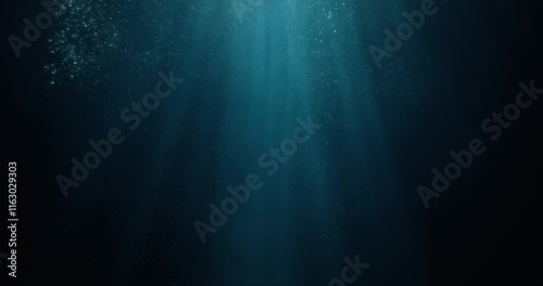 Long high-speed loopable 4K film slow-motion footage of underwater rays piercing ocean surface.  Enchanting beams of light flickering, ideal VFX background for vacation, snorkeling, summer adventures
