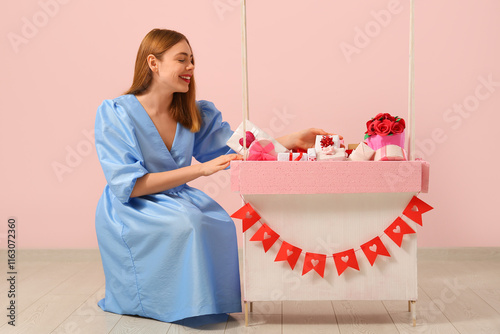 Young woman and paper booth...