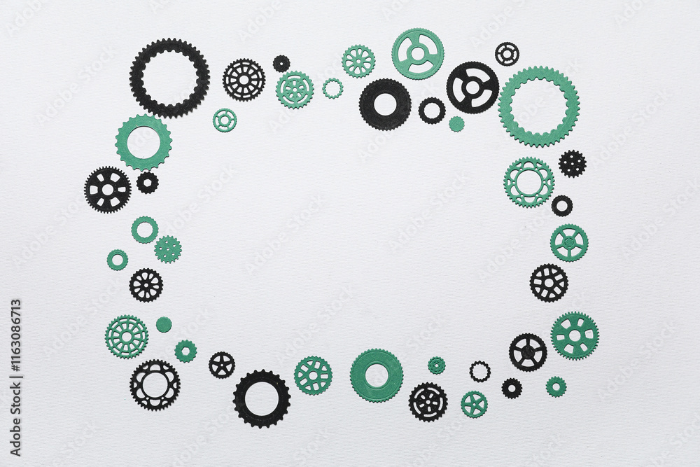 Fototapeta premium Frame made of different paper gears on grey background
