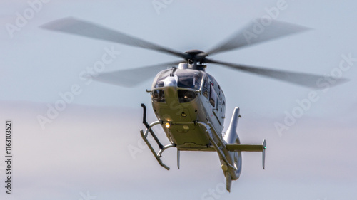 small civil helicopter in flight 