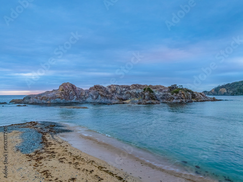 Cloud-covered sunrise over Guerilla Bay photo