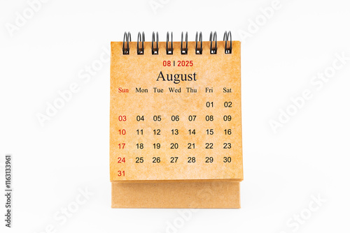 Brown mini desk calendar for August 2025 isolated on white. photo