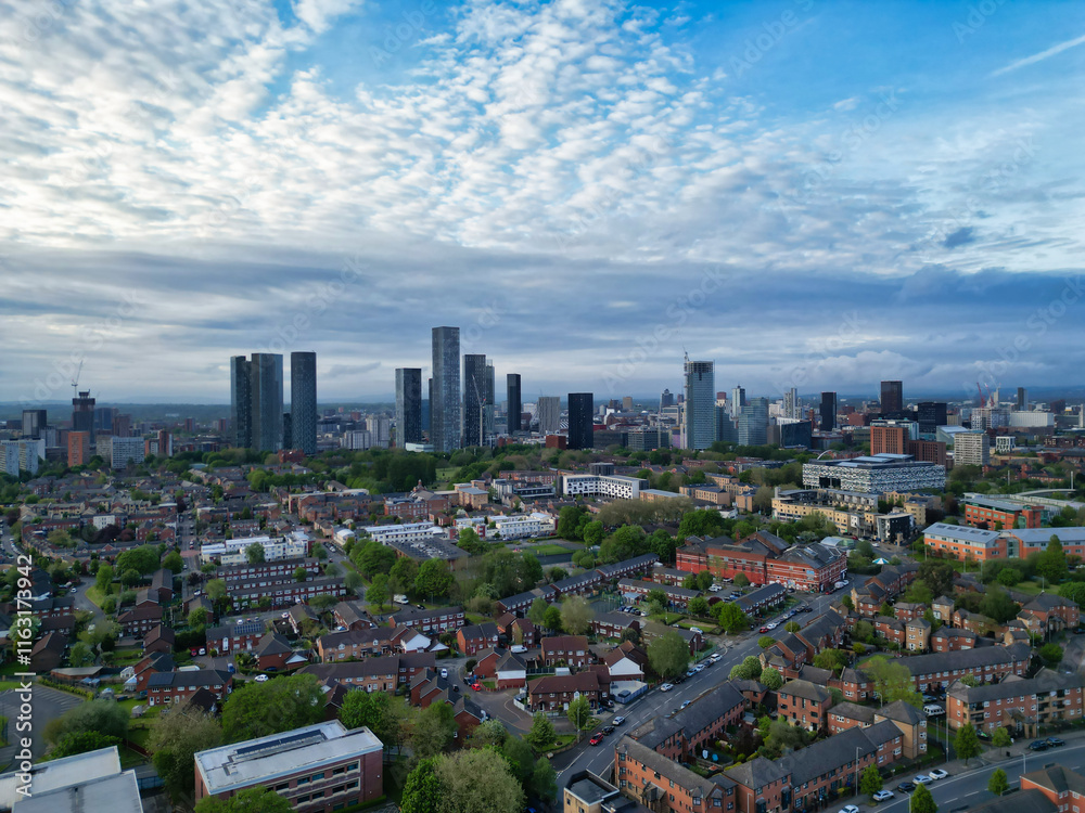 Obraz premium Aerial View of Buildings at Greater Manchester Central City, Northwest of England, United Kingdom. Aerial View Footage Was Captured with Drone's Camera on May 4th, 2024 During Sunset Time.