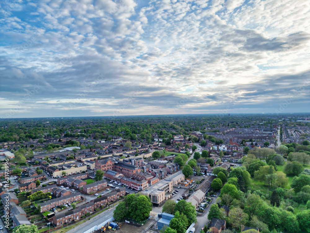 Obraz premium Aerial View of Buildings at Greater Manchester Central City, Northwest of England, United Kingdom. Aerial View Footage Was Captured with Drone's Camera on May 4th, 2024 During Sunset Time.