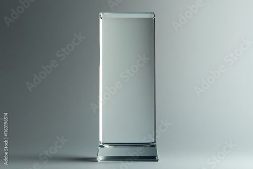 A Tall Clear Glass Rectangular Award Stands Alone