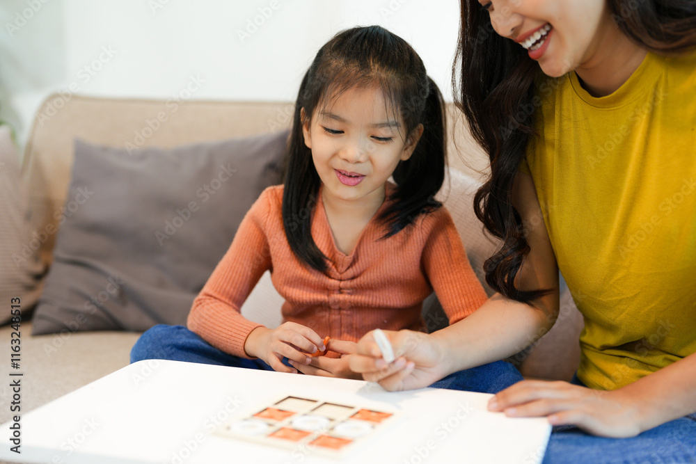 Happy family playing board game at home, happiness concept Happy family playing board game at home, happiness concept