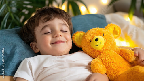 happy child sleeping peacefully with plush toy bear