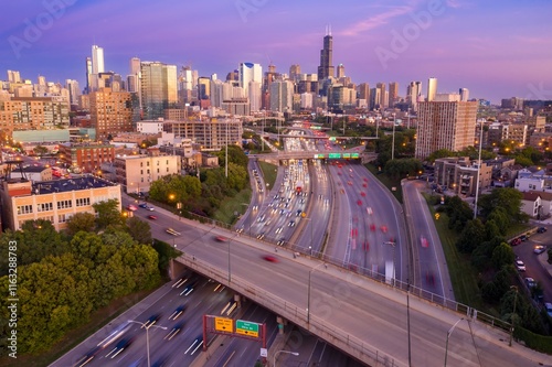 Chicago highway traffic at sunset. Busy I-90/94 interchange, commuters rush home. Urban cityscape backdrop. Interstate 90, Chicago, Illinois, United States photo