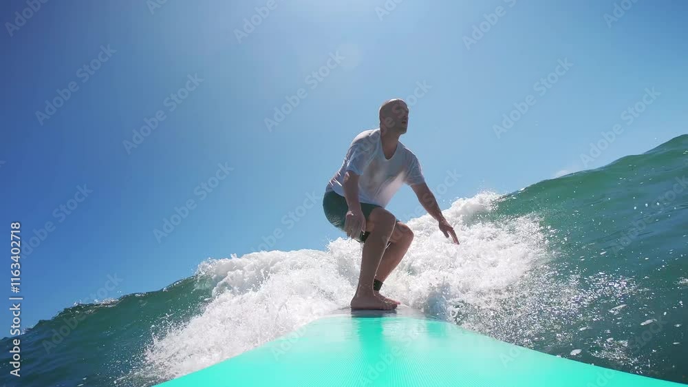 Man surfing on a sunny day in Mexico