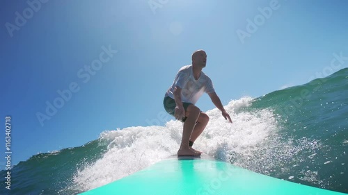 Man surfing on a sunny day in Mexico