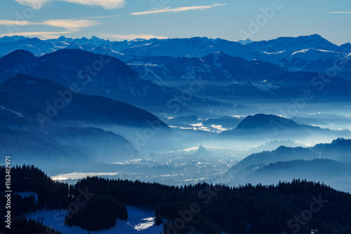 Panoramic view of the Inn Valley and the Kitzbühel Alps (Tyrol, Austria) in winter. Snow-covered mountains. Valleys in the mist photo