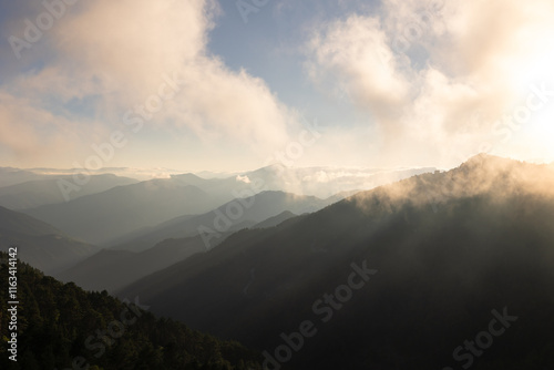 Landscape of the mountains and fog at sunset