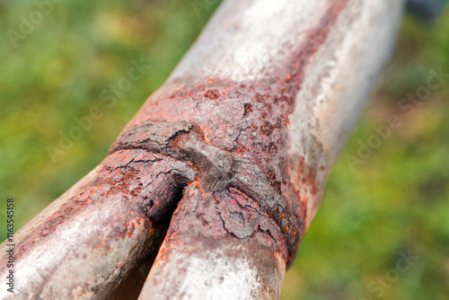 Rusty industrial pipe showing decay photo