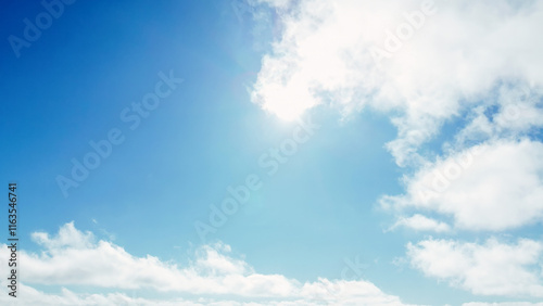 Sunny day with scattered white clouds