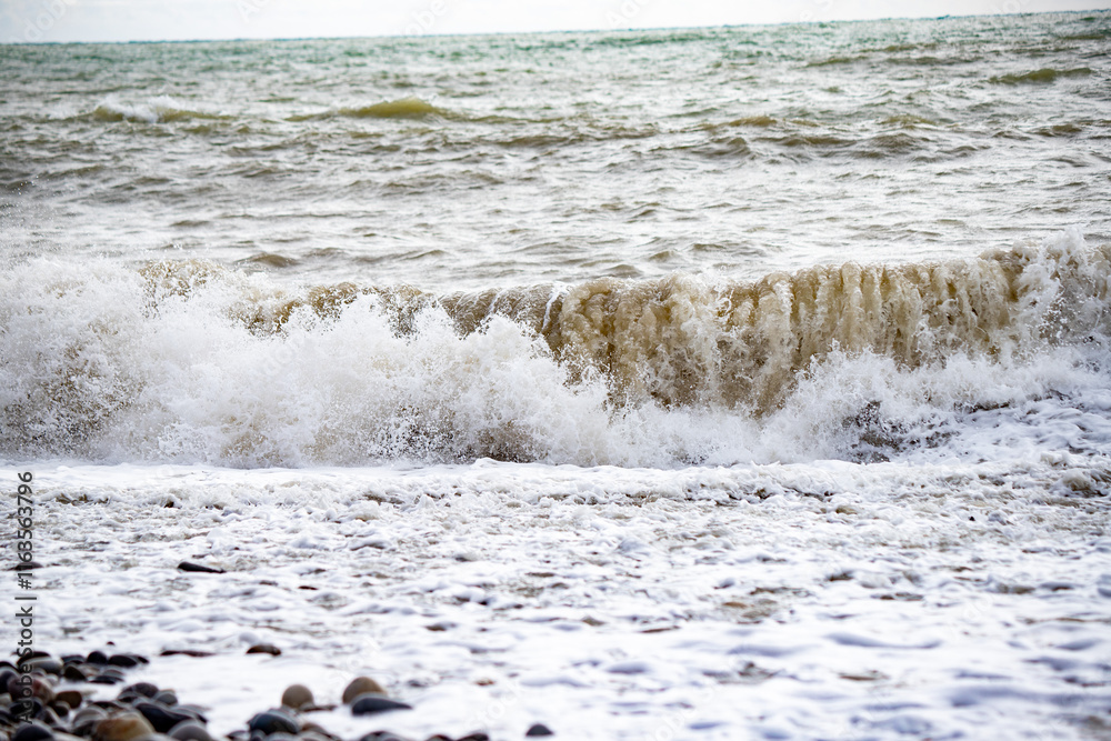 Seashore, small stones, sea wave. Marine background. Seashore, small stones, sea wave. Marine background.