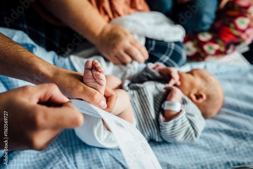 Newborn baby getting footprint done at hospital photo