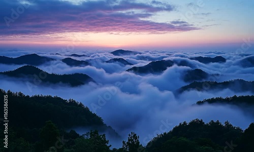 Wallpaper Mural A serene sunrise over misty mountains, creating a tranquil and picturesque landscape. Torontodigital.ca