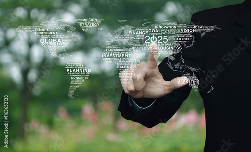 Fototapeta Naklejka Na Ścianę i Meble -  Businessman pressing 2025 start up business icon with global words world map over blur flower and tree in park, Happy new year 2025 global business start up, Elements of this image furnished by NASA