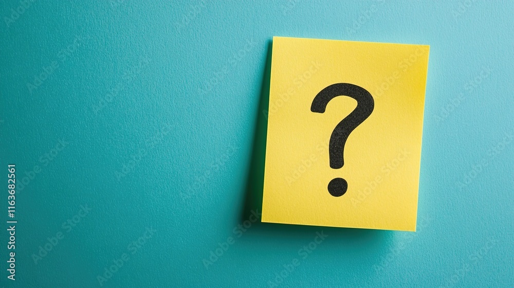 A yellow sticky note with a black question mark on a teal background A yellow sticky note with a black question mark on a teal background