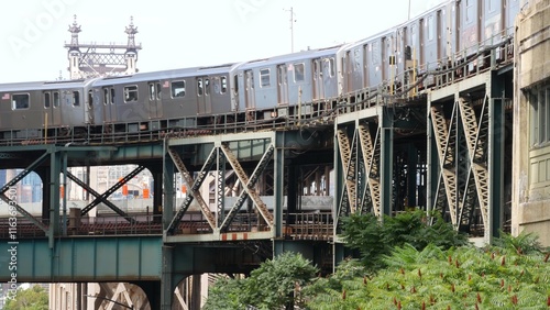 New York elevated subway, metropolitan bridge, metro track above street. Railway transport, vintage Queensboro station railroad line. Queens public train transportation. Long Island city United States photo