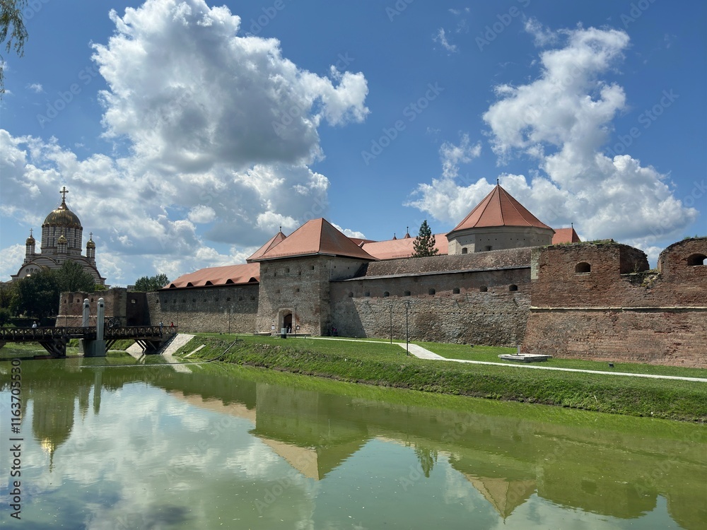 Fototapeta premium Majestic Medieval Fortress Surrounded by a Defensive Moat