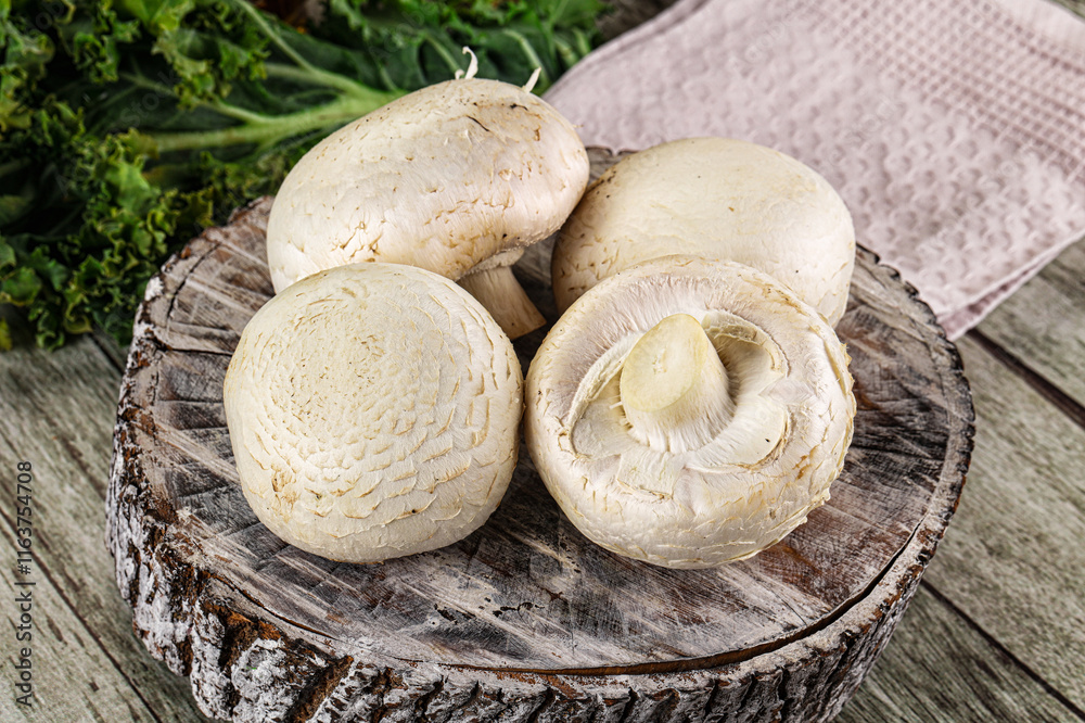 White champignon mushrooms heap over board White champignon mushrooms heap over board