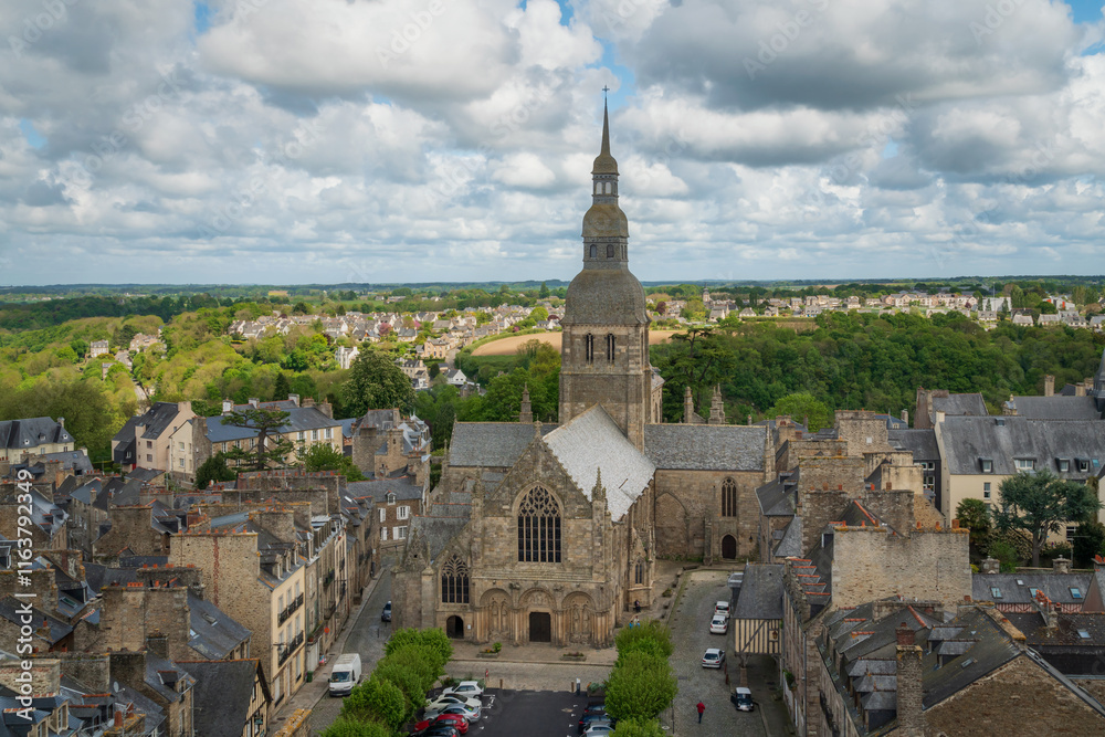 View of the Basilica of Saint-Sauveur from the observation deck of the Dinan Clock Tower on a sunny summer day, Dinan, Cotes-d'Armor, Brittany, France View of the Basilica of Saint-Sauveur from the observation deck of the Dinan Clock Tower on a sunny summer day, Dinan, Cotes-d'Armor, Brittany, France