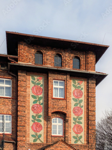 Old bricks building with mosaic 