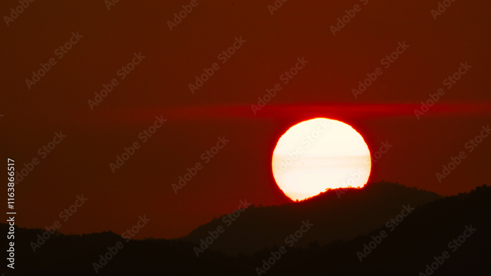 Timelapse shot of a beautiful sunrise over the horizon with an orange winter sky. Close-up of the sunrise. Morning dawn landscape. Timelapse shot of a beautiful sunrise over the horizon with an orange winter sky. Close-up of the sunrise. Morning dawn landscape.