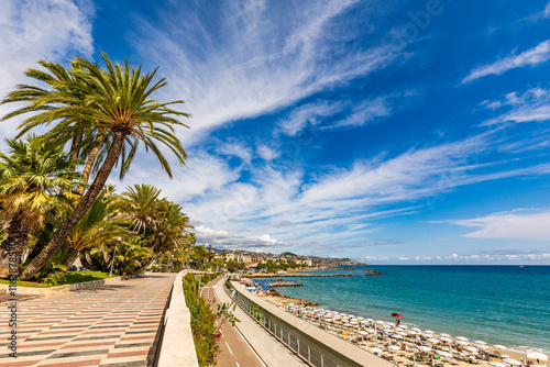 Scenic view of the Sanremo waterfront promenade with palm trees and Mediterranean Sea