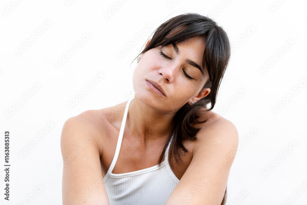 Beautiful woman with eyes closed against white background Beautiful woman with eyes closed against white background