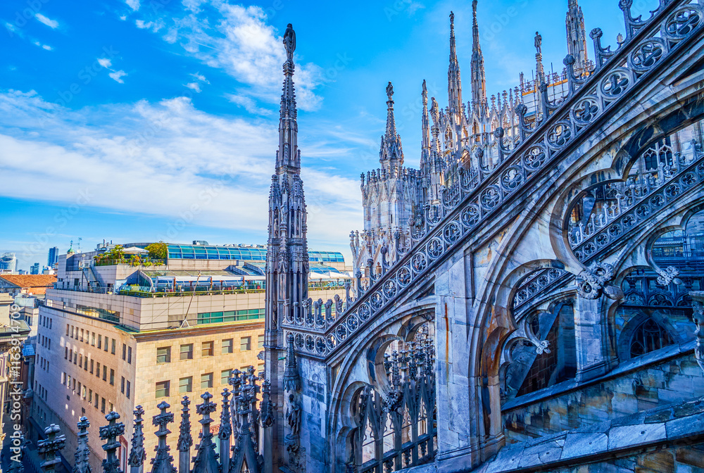 Gothic flying buttresses with intricate carvings on the roof of Milan Cathedral, Italy