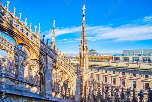 Gothic flying buttresses with intricate carvings on the roof of Milan Cathedral, Italy