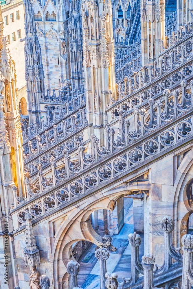 Decorative stonework and flying buttresses on the roof of Milan Cathedral, Italy