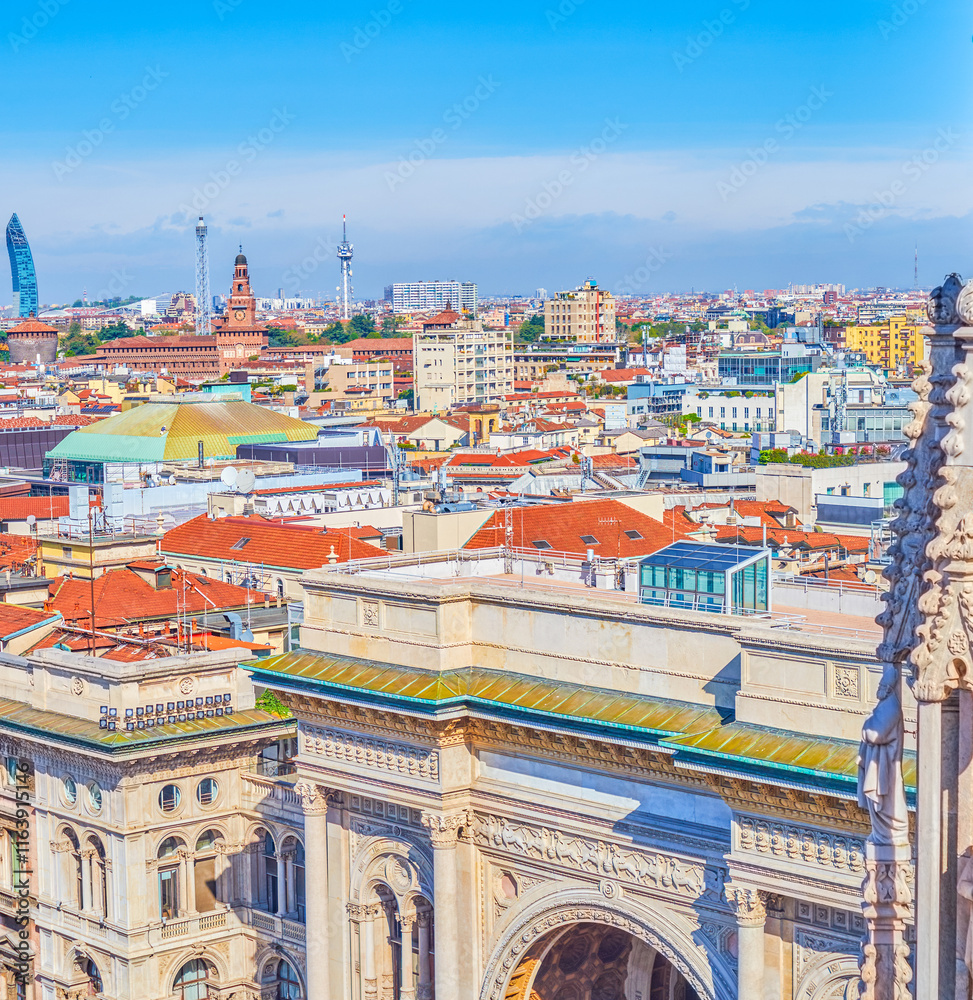 Triumphal Arch of Galleria Vittorio Emanuele II and roofs of citycenter of Milan, Italy