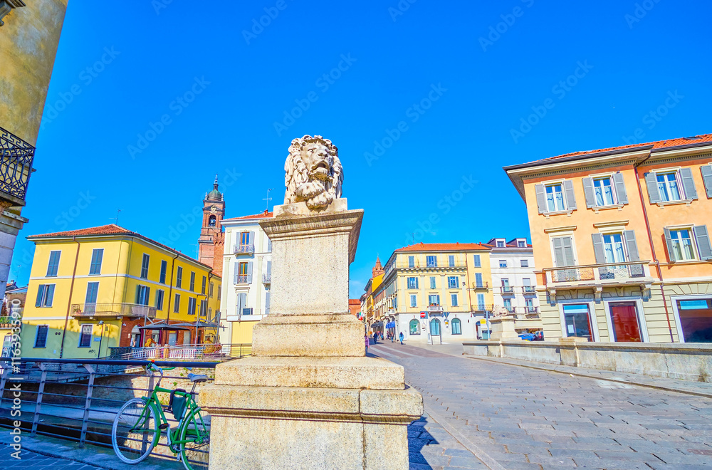 Ponte dei Leoni bridge with stone sculptures of lions, in Monza, Italy