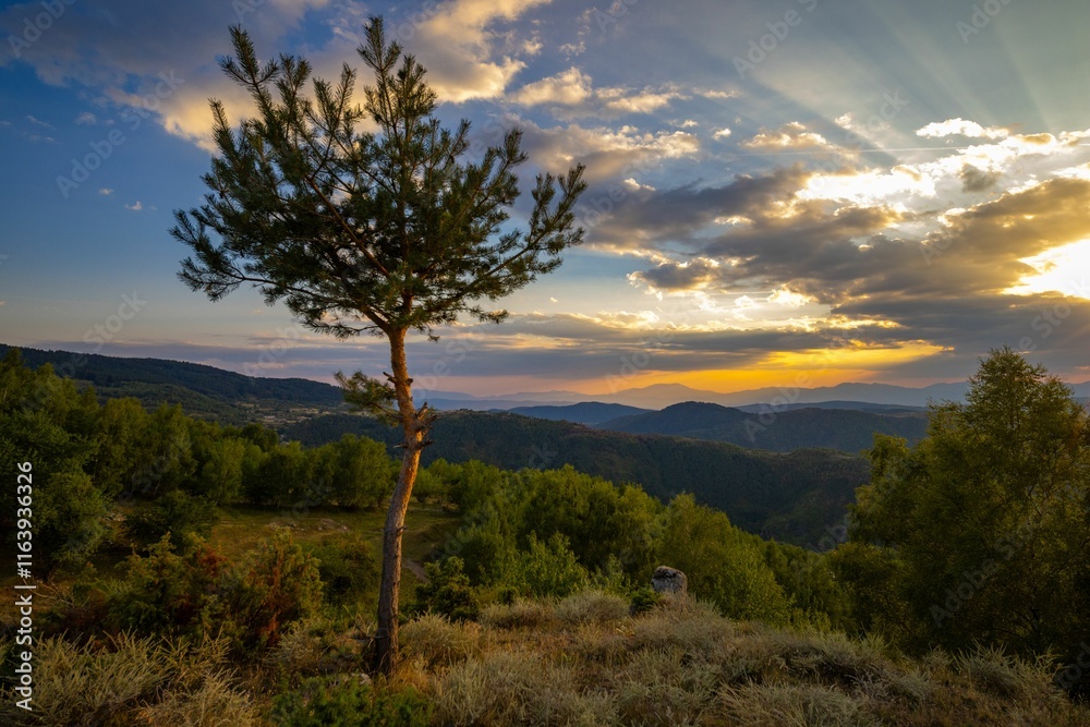 Scenic sunset over a mountainous landscape. Scenic sunset over a mountainous landscape.