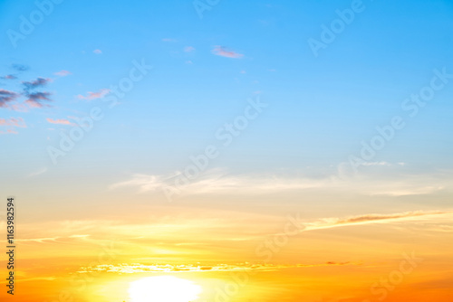 Sky,sunset, beautiful , luxury soft gradient orange gold clouds and sunlight on the blue sky perfect for the background, Sunrise on morning or everning in winter warm time ,Twilight summer,silhouette photo