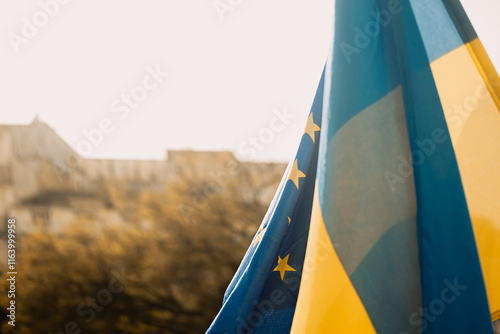 Ukrainian and European Union flags at a rally against the war