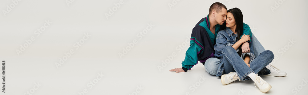 A beautiful couple embraces in a studio, showcasing affection and stylish outfits, banner A beautiful couple embraces in a studio, showcasing affection and stylish outfits, banner