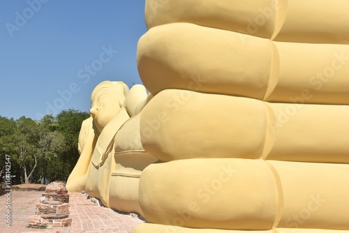 ancient reclining Buddha at Lokaya Sutha after renovate painting colors from white to yellow  photo