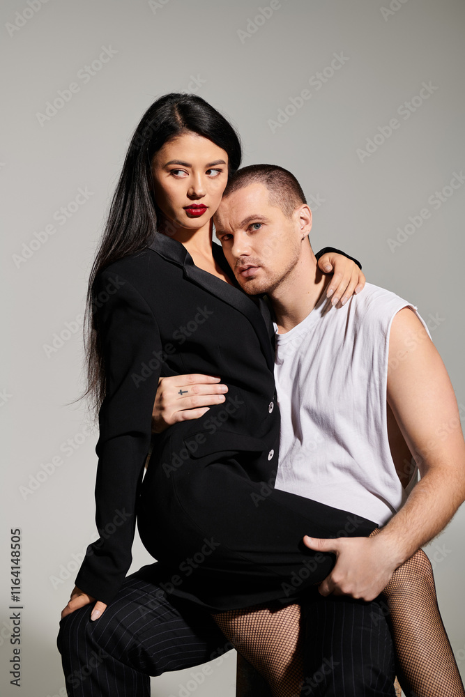 A beautiful couple showcases their romance in a trendy studio, perfect for Valentines Day. A beautiful couple showcases their romance in a trendy studio, perfect for Valentines Day.