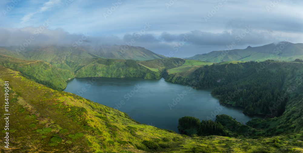 Obraz premium Aerial view on the crater lake lagoa Funda in a volcanic caldera on the isle of Flores, Azores archipelago Portugal