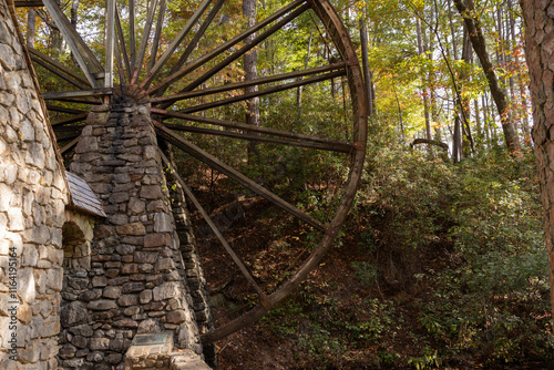 Old grist mill with water wheel photo