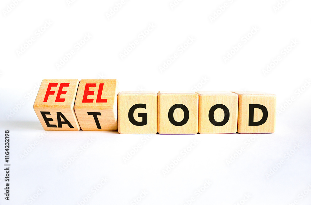 Eat and feel good symbol. Concept words Eat good Feel good on wooden cubes. Beautiful white table white background. Healthy lifestyle eat and feel good concept. Copy space. Eat and feel good symbol. Concept words Eat good Feel good on wooden cubes. Beautiful white table white background. Healthy lifestyle eat and feel good concept. Copy space.