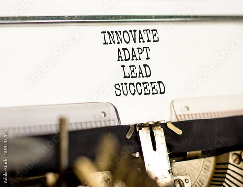 Innovate adapt lead succeed symbol. Concept words Innovate Adapt Lead Succeed typed on beautiful old typewriter. Beautiful white background. Business innovate adapt lead succeed concept. Copy space. photo